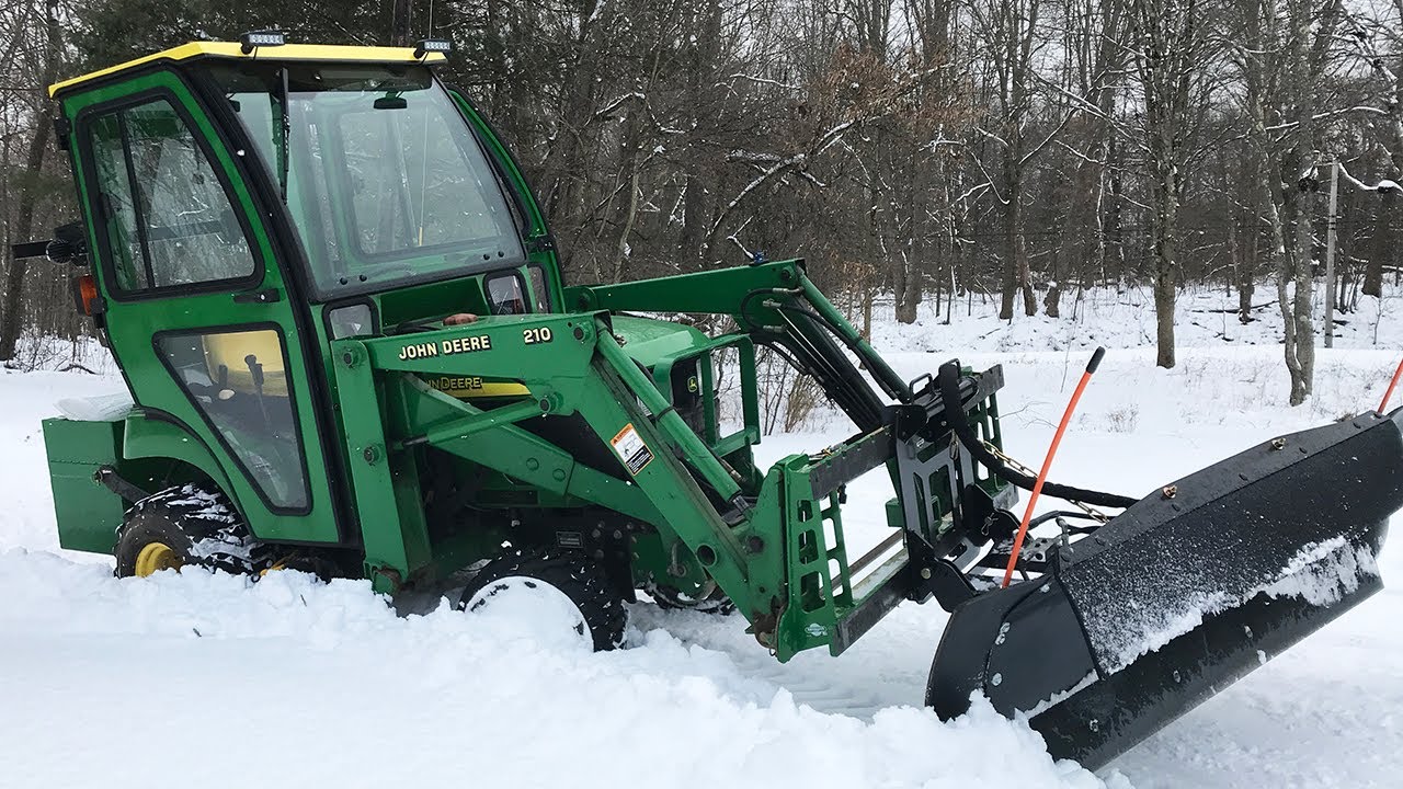 Plowing snow - tar and chip driveway - and getting stuck with the John Deere tractor 4K