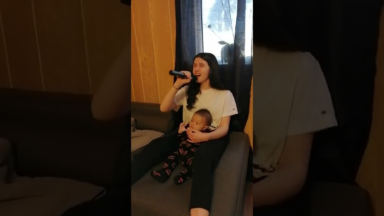 Big sister singing to Baby brother