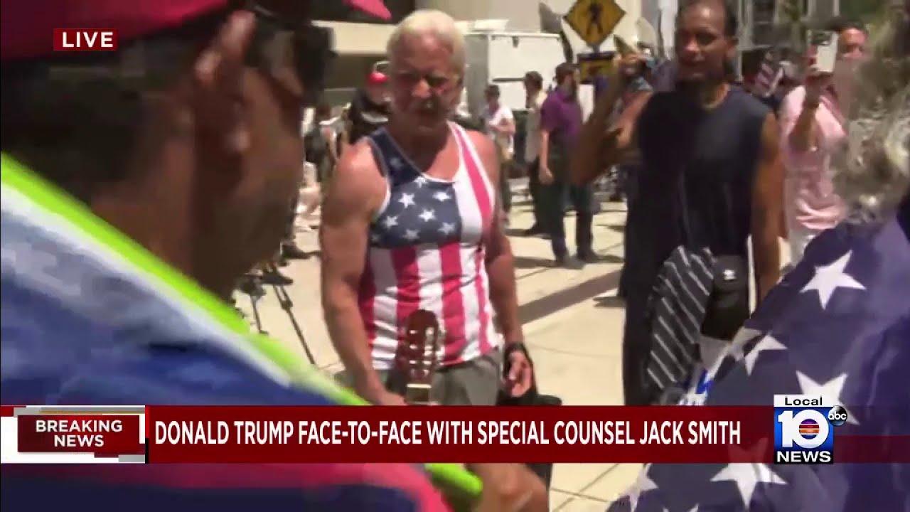 Protesters stand outside federal courthouse in Miami