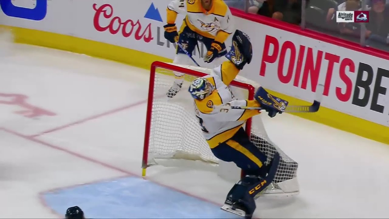 David Rittich knocks into his own goal post as he tries to catch the puck
