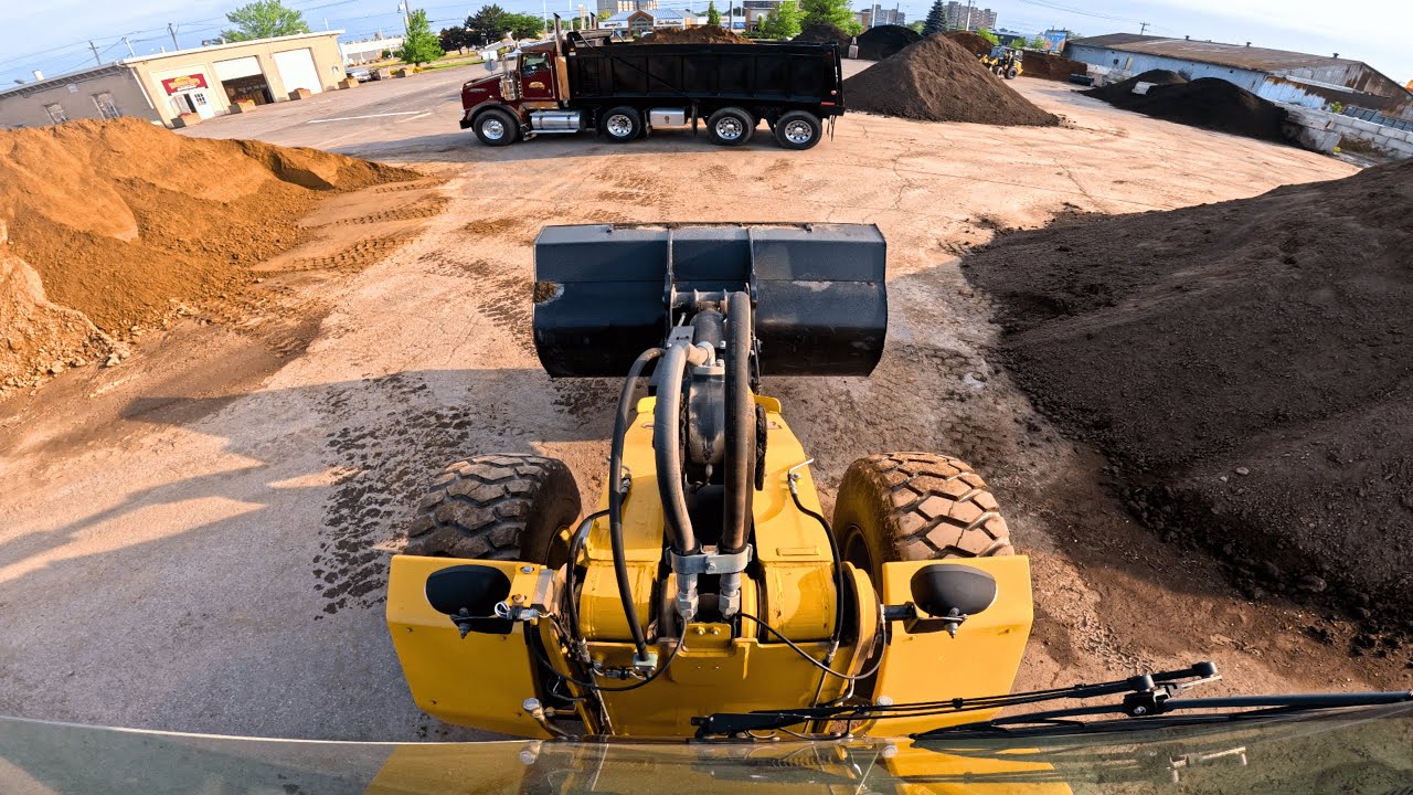Loading a Tri-Axle Dump Truck with my CAT 930H on a Sunny Morning!