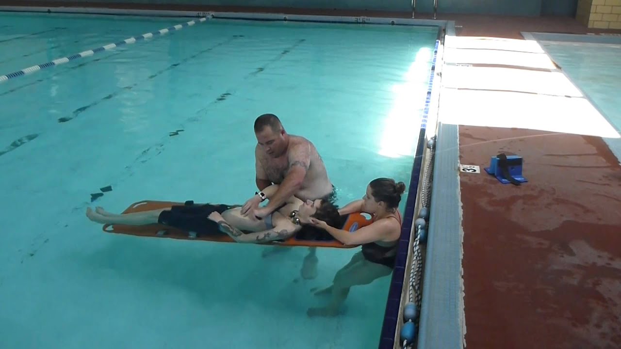 Lifeguarding Drill: Backboarding 2-rescuer in shallow water ARC