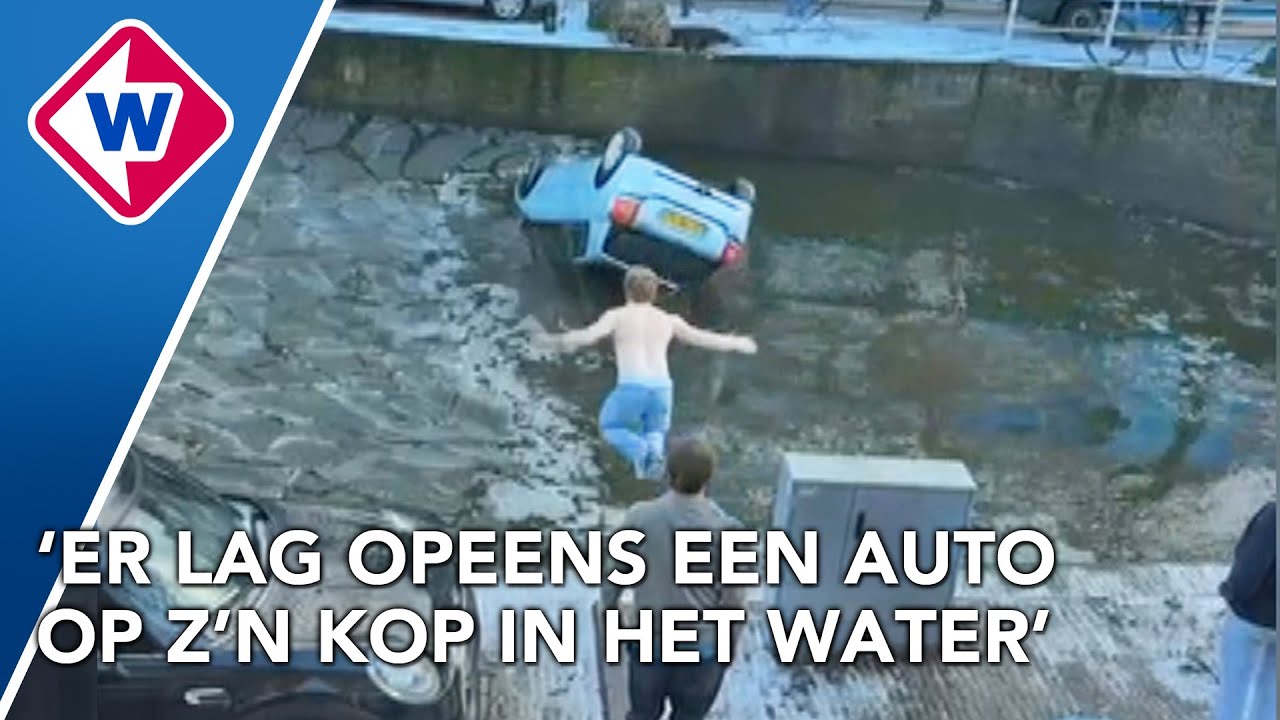 Student springt in gracht om vrouw uit auto te redden
