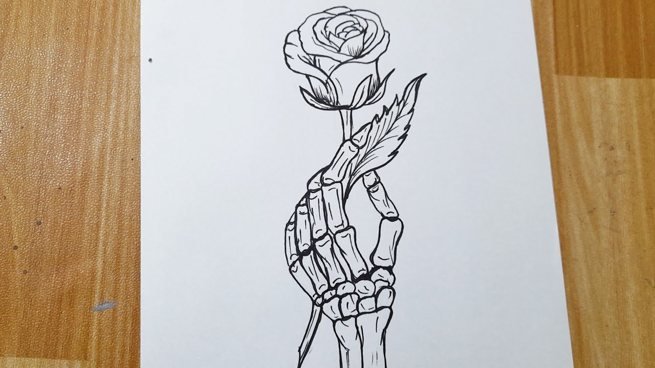 How to draw a skeleton hand holding a rose