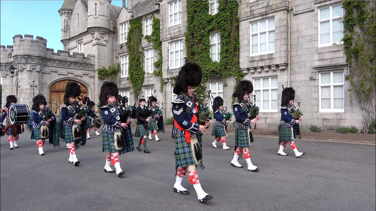 Battater Pipe Band March in front of Balmoral Castle to mark the Queen's 2022 Platinum Jubilee
