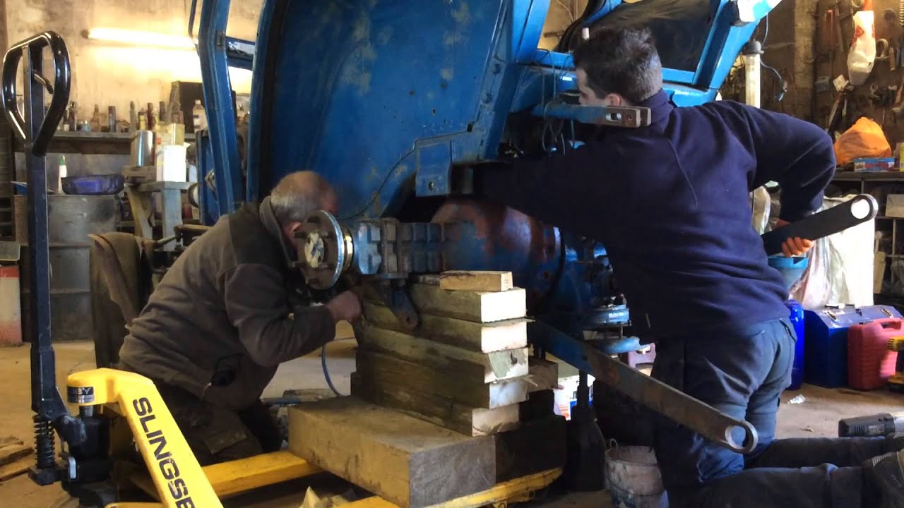 How to remove rear half axle on Ford 4100 to replace hub seal