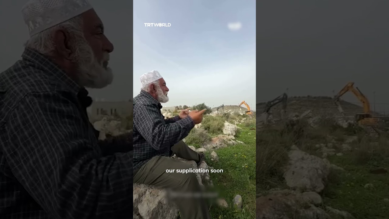 Palestinian man prays to God as Israeli forces demolish his family home