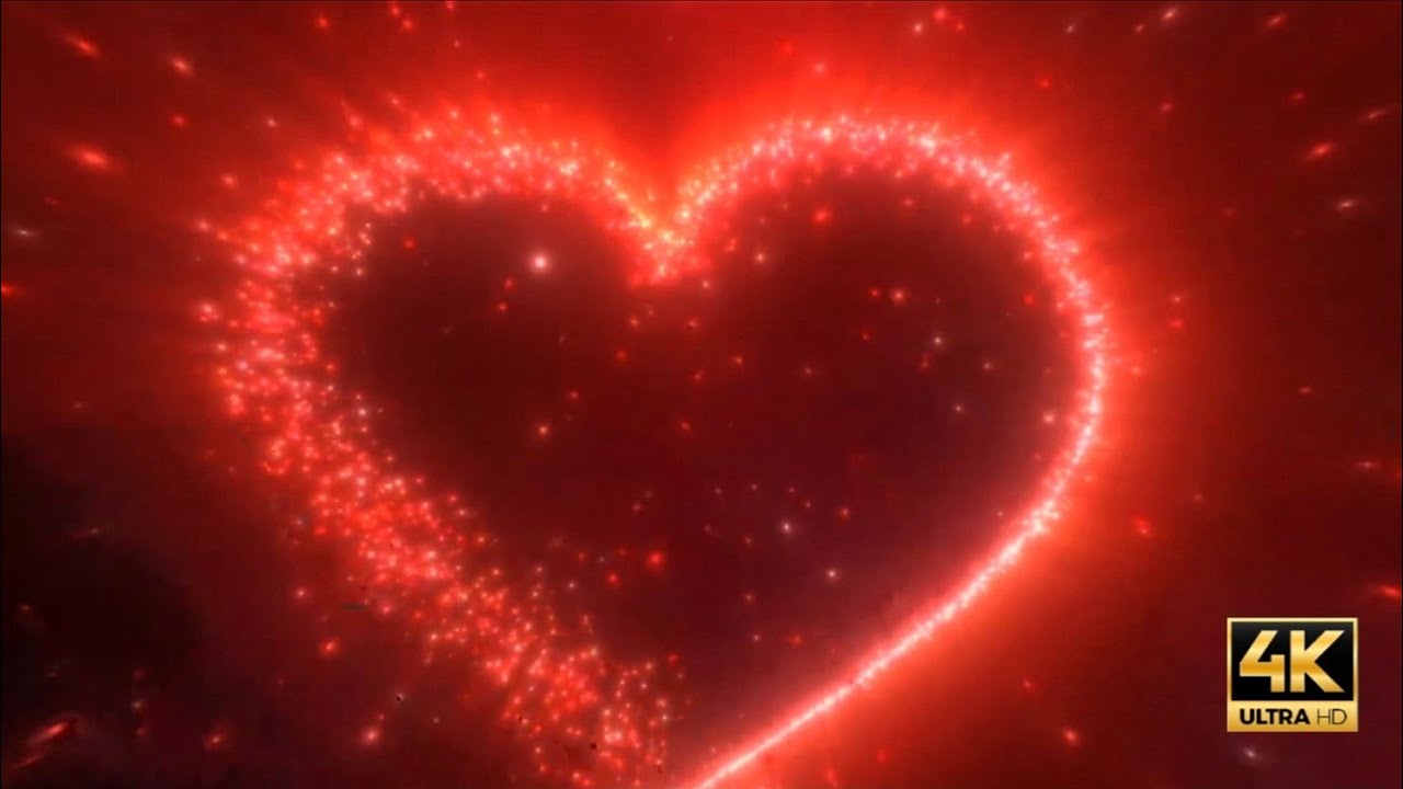 4k 10min Valentine's day background loop  glowing red love heart made of particles 