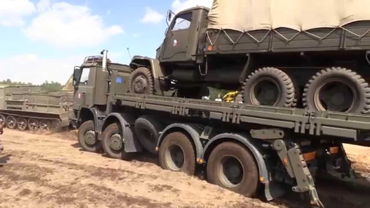Soviet artillery tractor ATS-59 pulls army truck Tatra and Praga V3S -