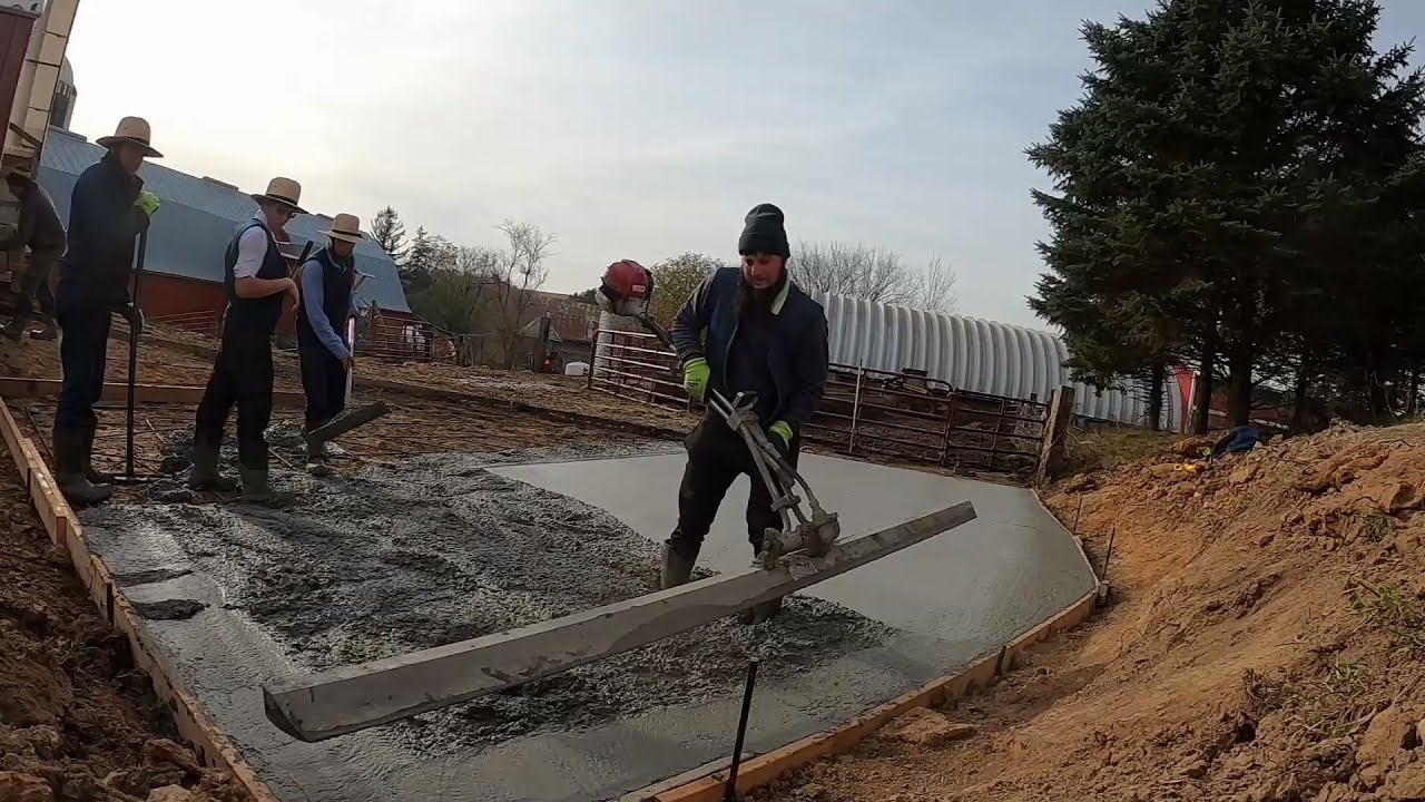 Pouring Concrete for Feed Pad Expansion; pouring and leveling 30X30 concrete for cows