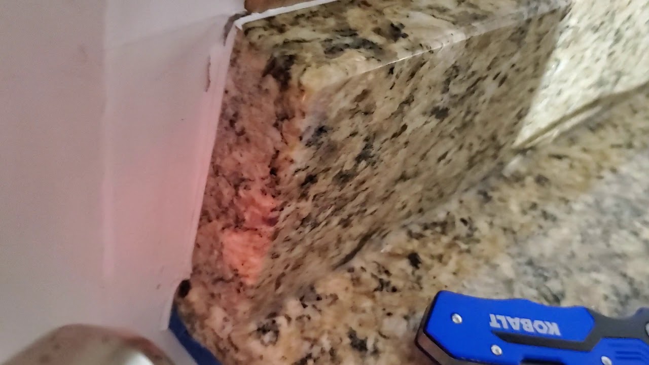 Removing Granite Countertop Backsplash Lip in under 10 minutes.