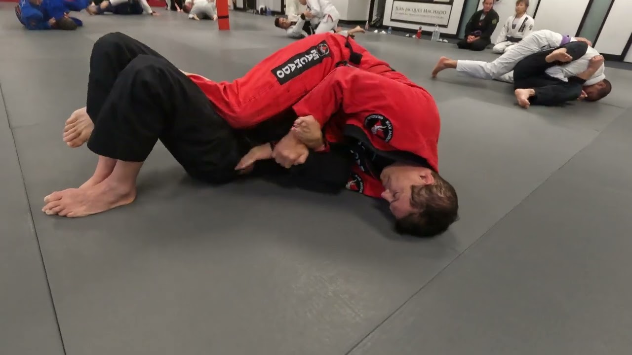 Jean Jacques Machado rolling with JJM HQ instructor Mark Armstrong
