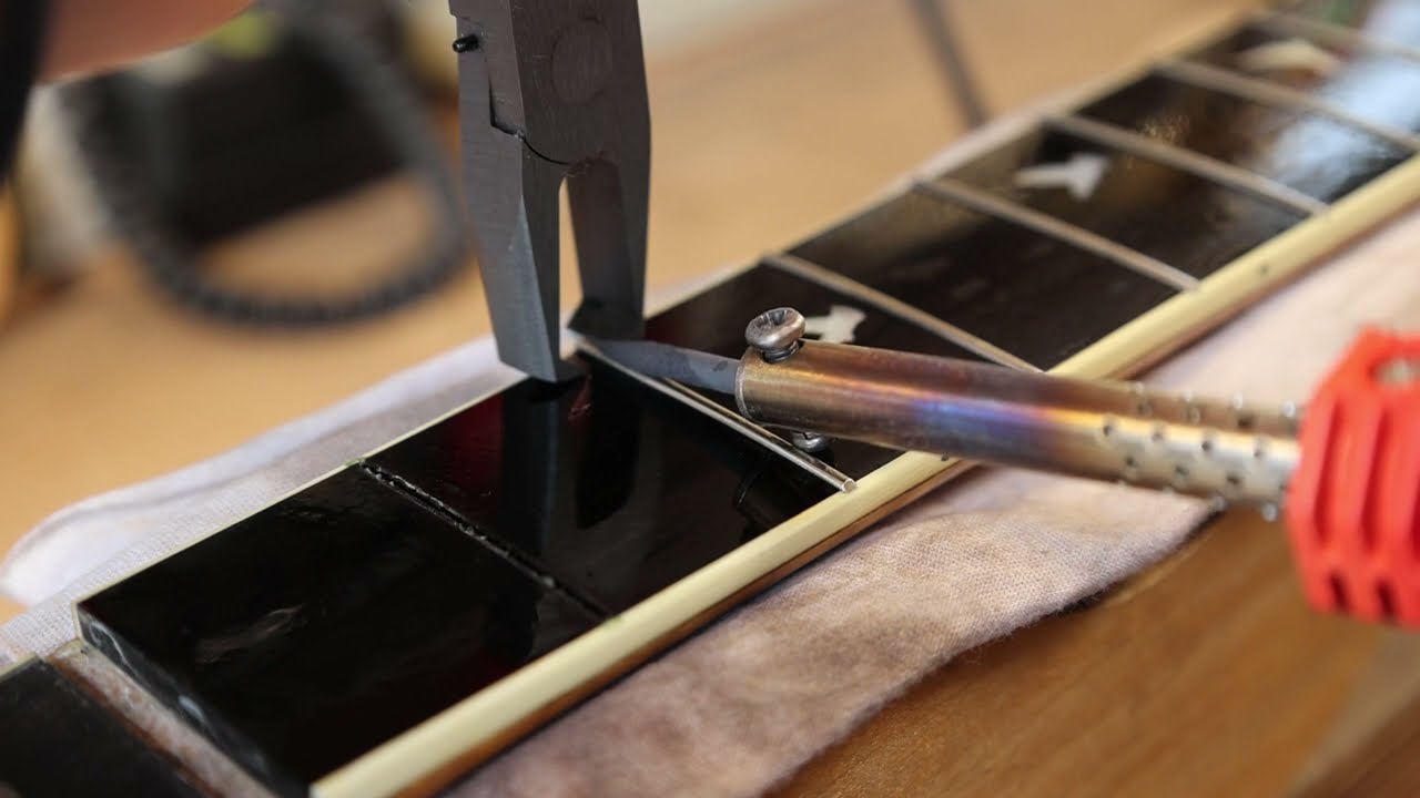 Pulling out a fret on Greven J-Herringbone CM