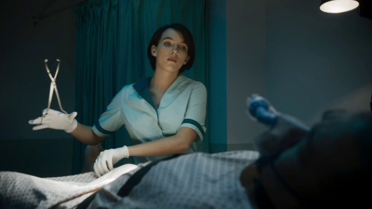 Jodie Comer in latex gloves