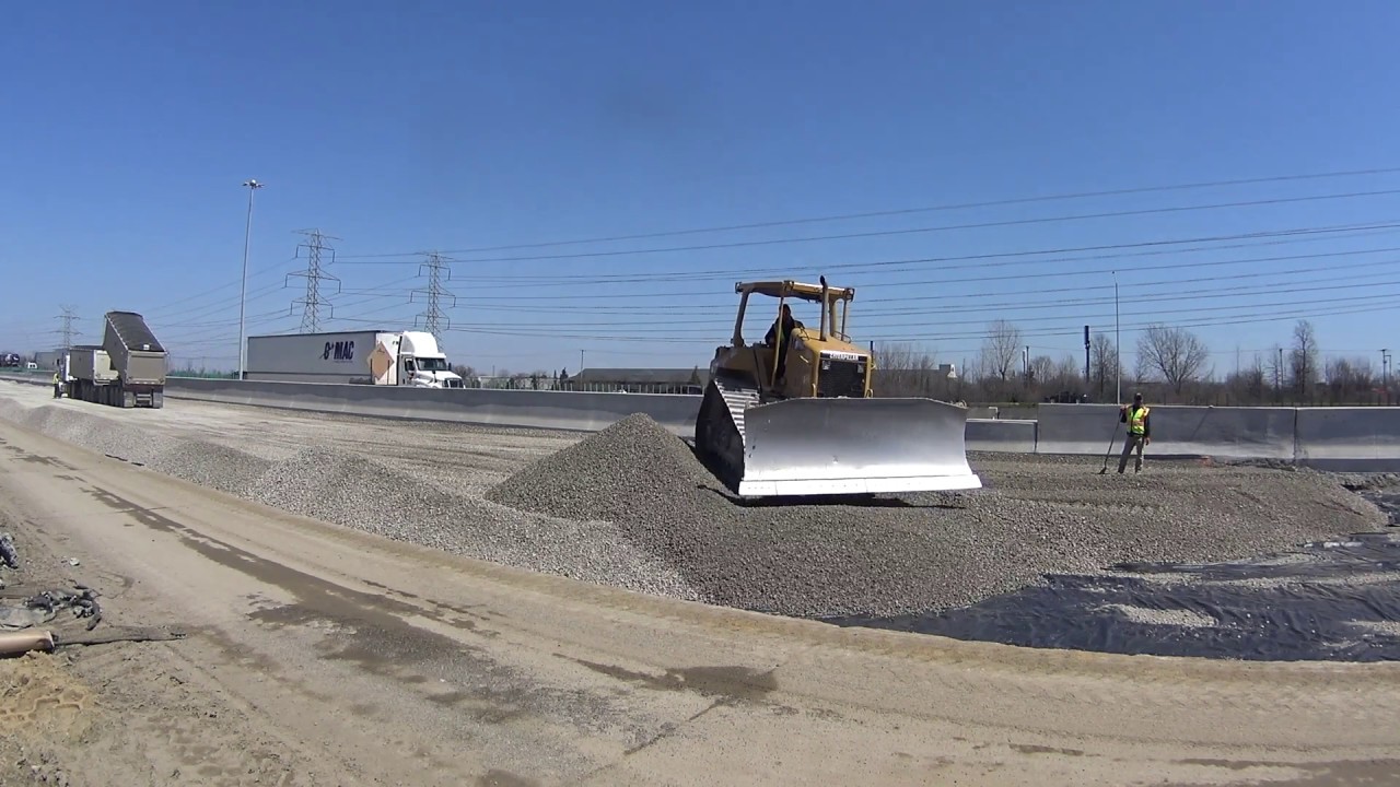 Cat D6N Bulldozer Pushing Stone (Outside View)