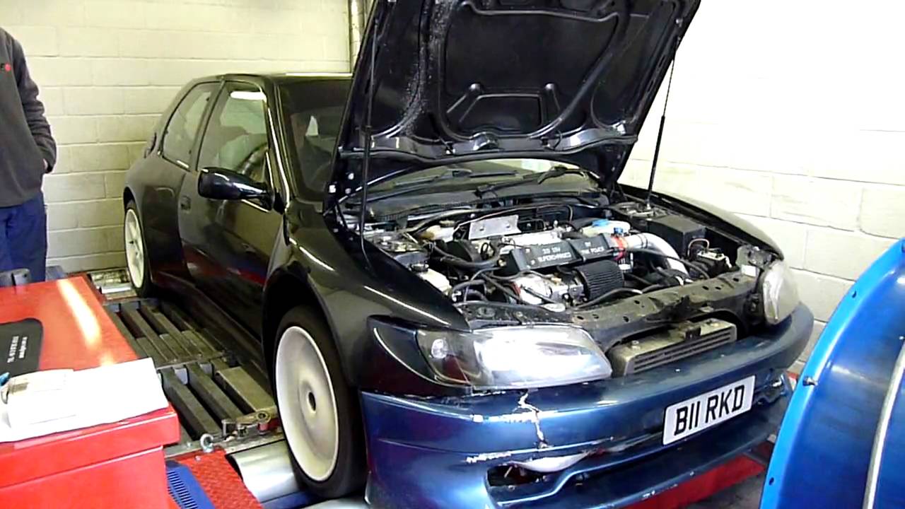 Supercharged peugeot 306 GTI-6 on the rolling road.