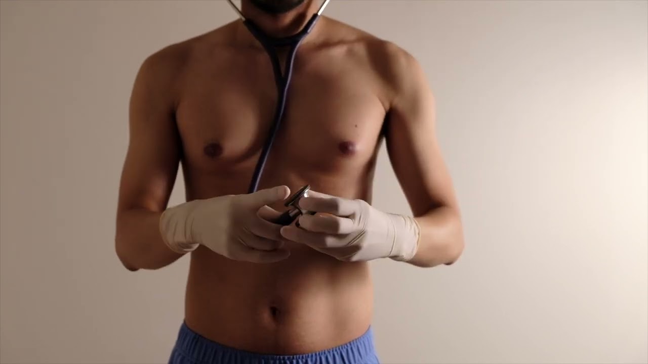 Doctor Dons White Latex Gloves for Medical Exam