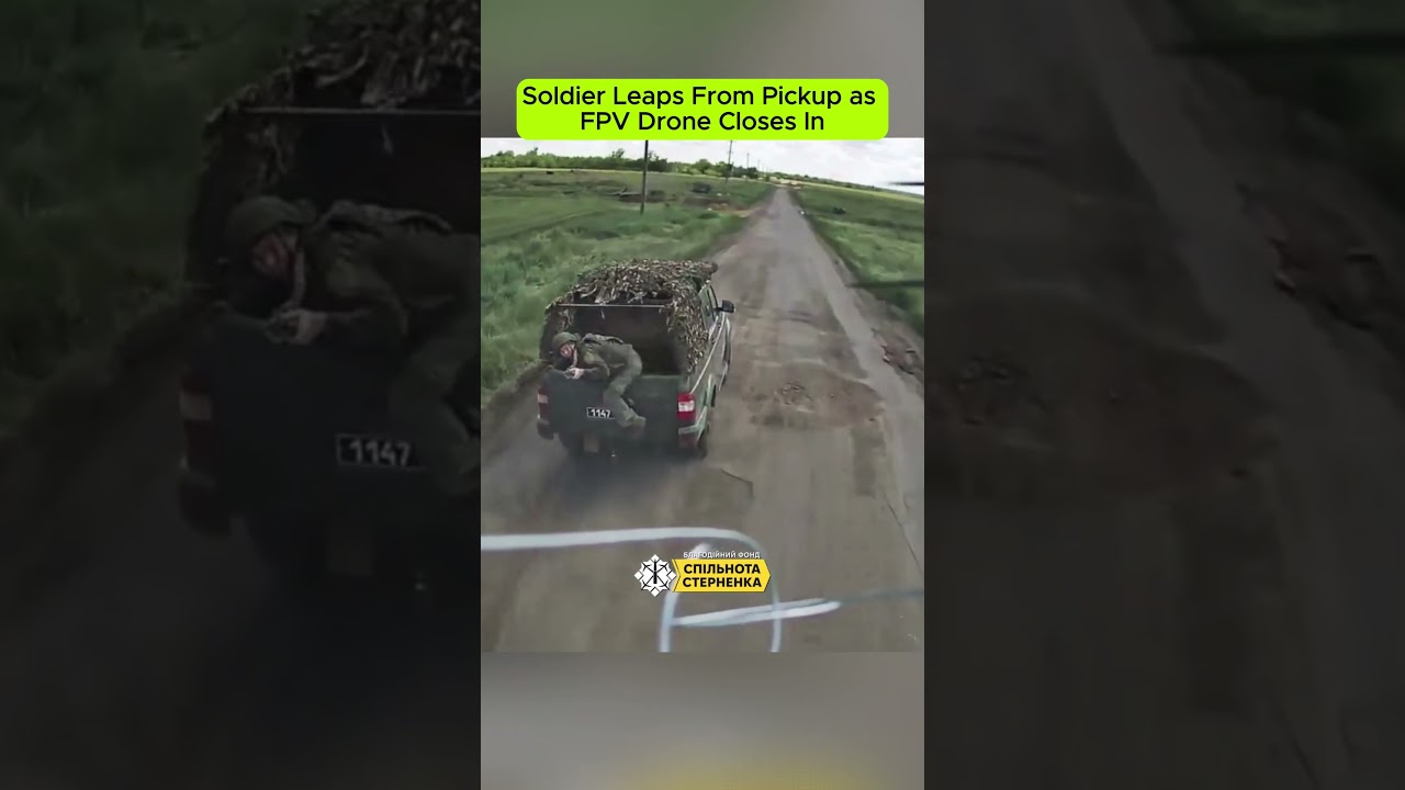 Soldier Leaps From Pickup as FPV Drone Closes In Combat Footage.