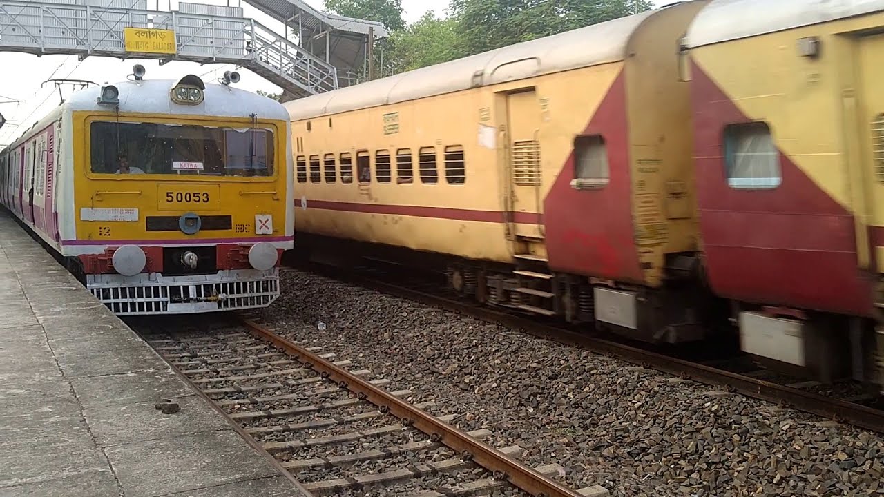 Perfect Express Train v Local Train Crossing at Rail Platform