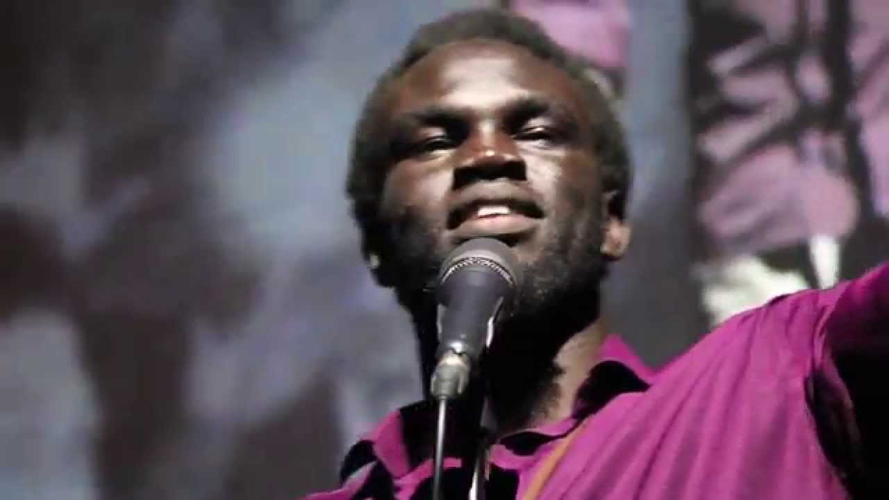 Abraham Nouk performing at the UWRF 2014 Poetry Slam