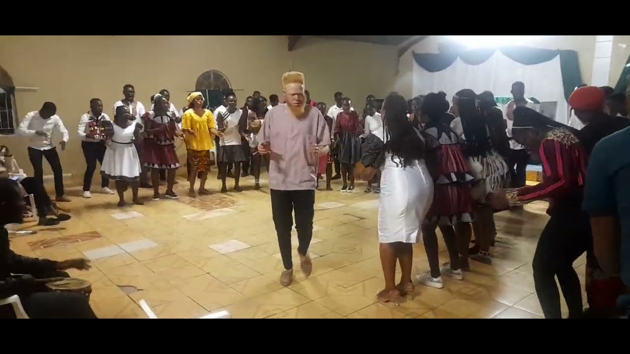 Kavango Regional Youth choir and Oshakati Youth Choir doing omthigululwakalo conducted by Sir John