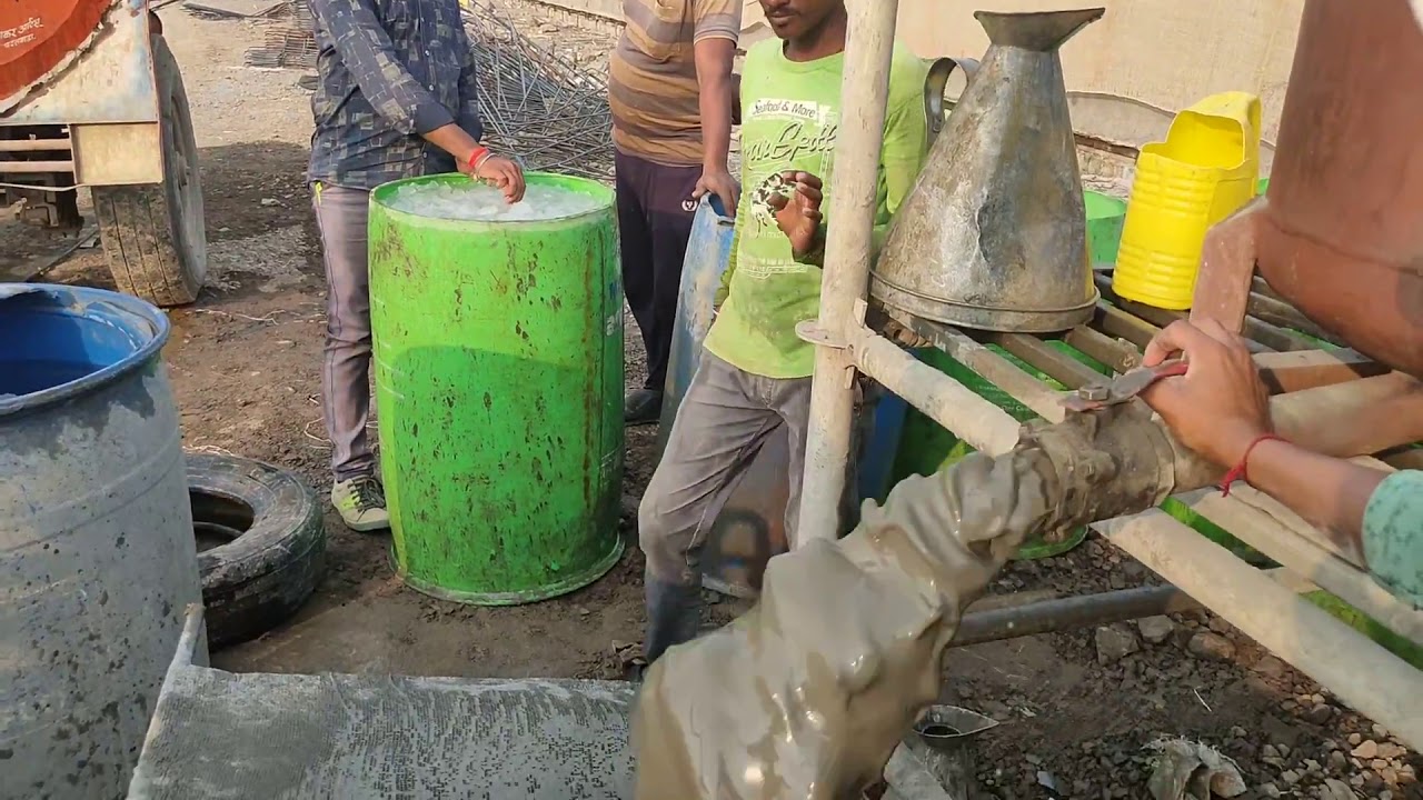 GROUTING POST TENSIONING I-GIRDER WITH CEMENT GROUT.