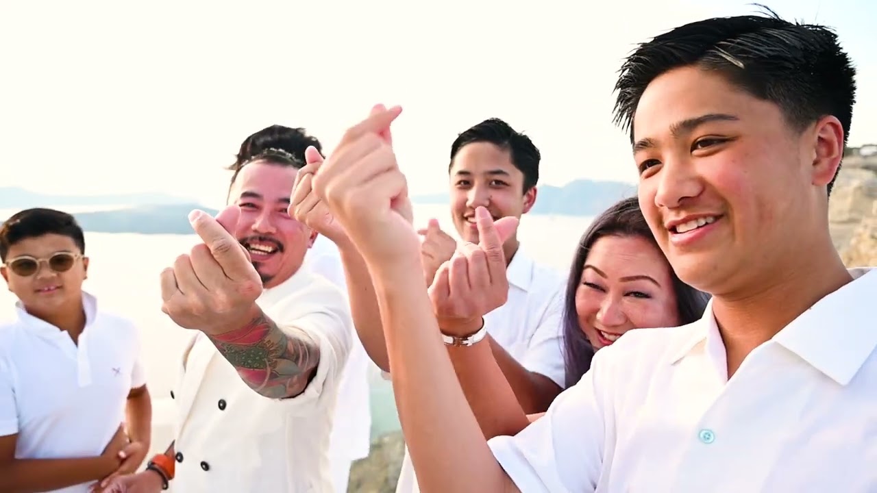 Elaine turns 50 in style with the most stunning Santorini caldera view behind her 💙✨