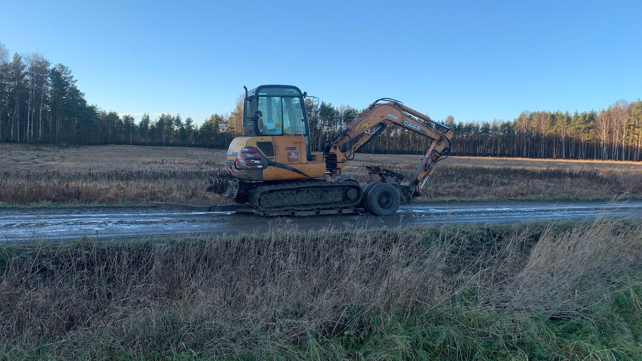 Katsoja päkitsin avaus ja kaivinkoneen siirto työmaalle 4K