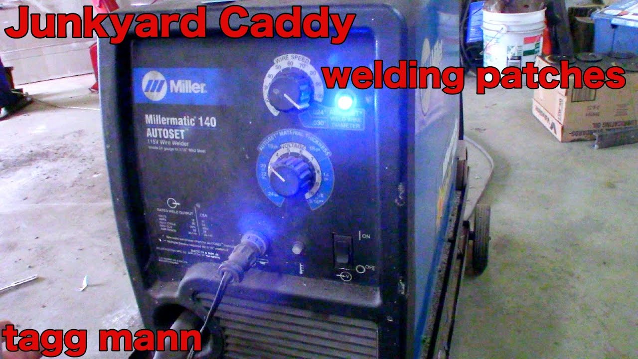 Junkyard Caddy welding in patches with the Miller 140