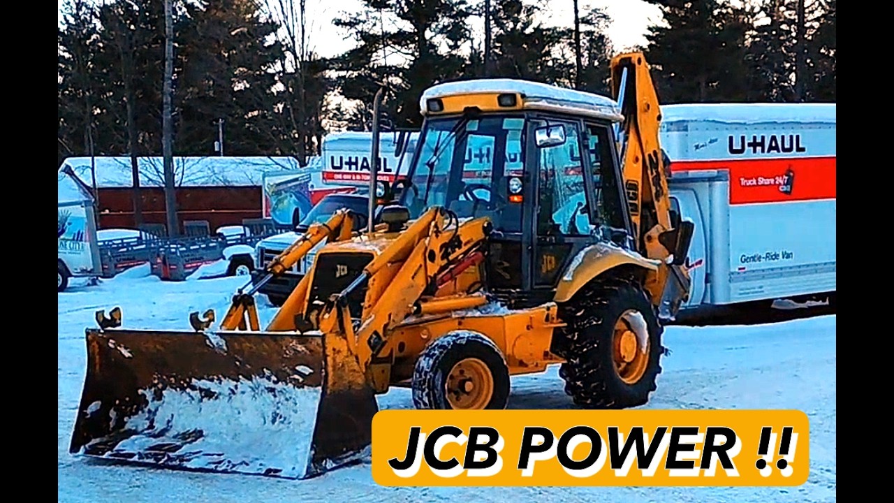 Big Backhoe moving piles of  snow, Getting it Done JCB style..