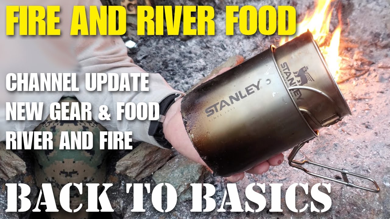 Bushcraft hike camp on the river with fire and beans