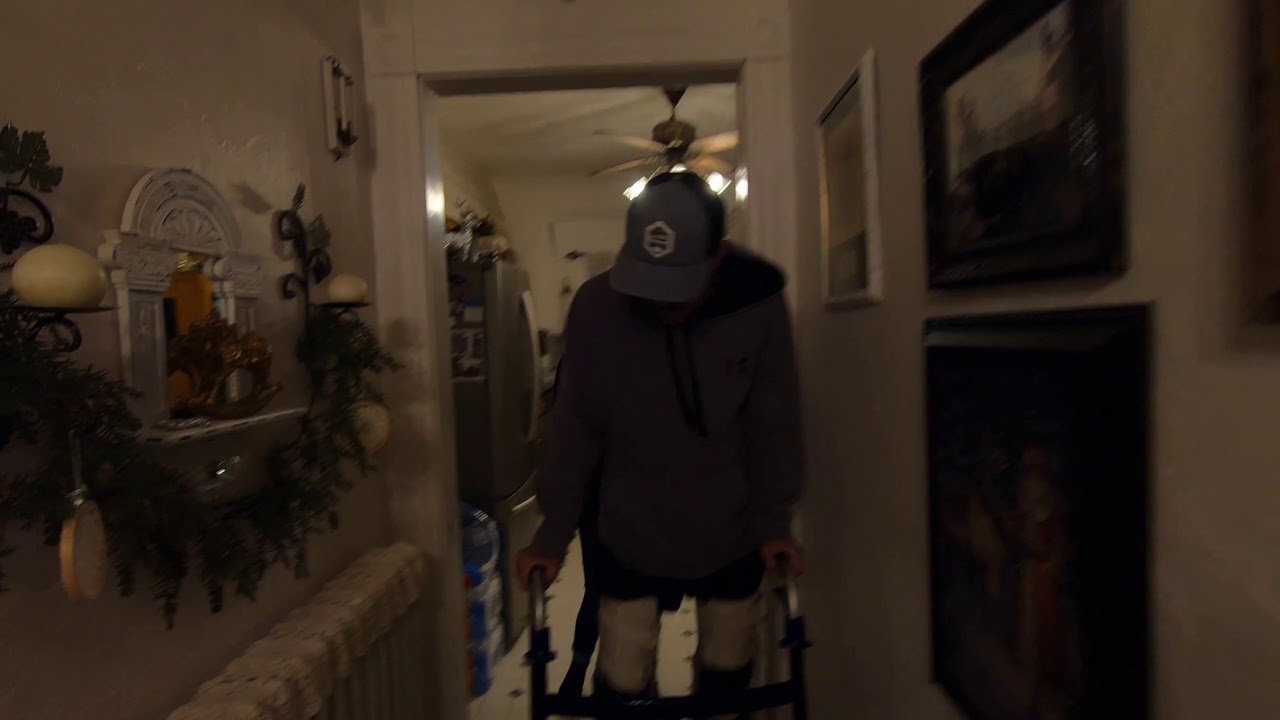 Quadriplegic Walking With Canes. 