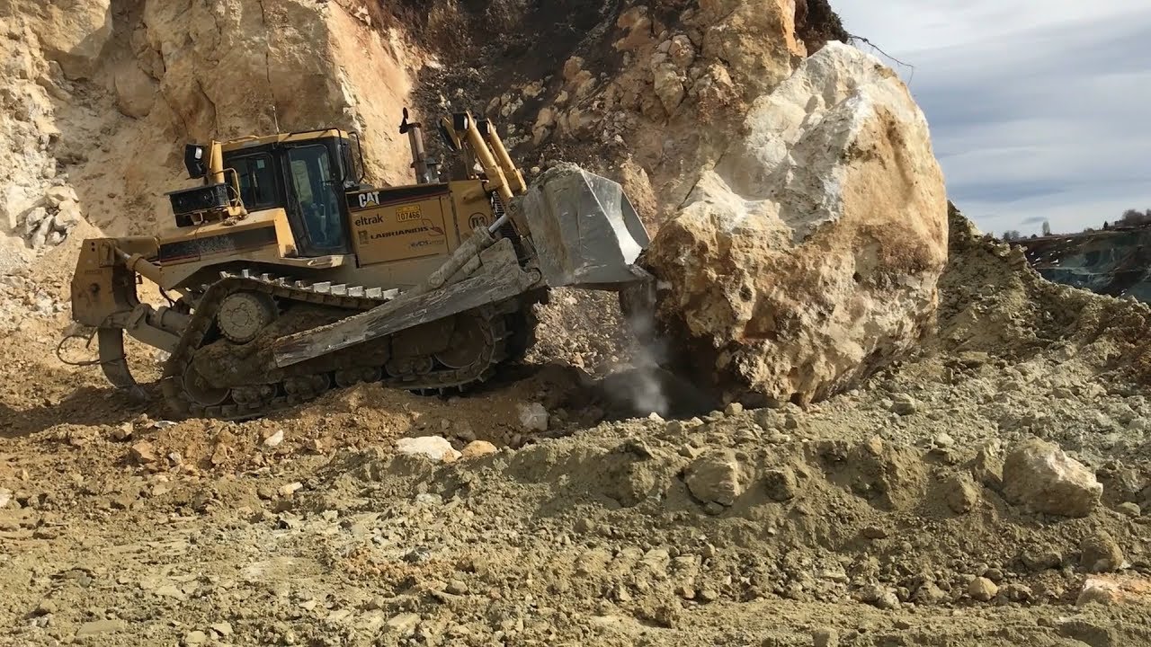 Caterpillar D8T Bulldozer Pushing Huge Rocks - Labrianidis SA