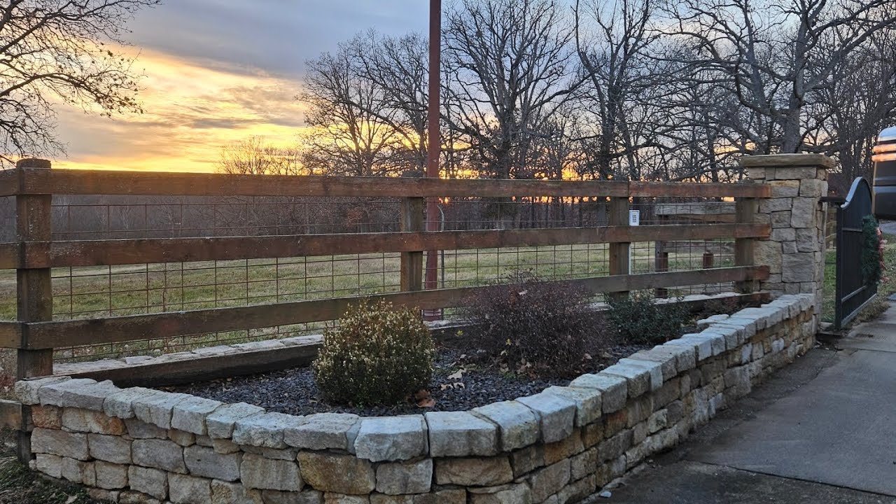 Power Washing Black Molded Brick Retaining Wall after soaking in solution