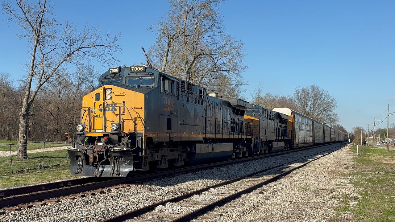 CSX 7006 leads X275 with a friendly engineer at Horse Cave