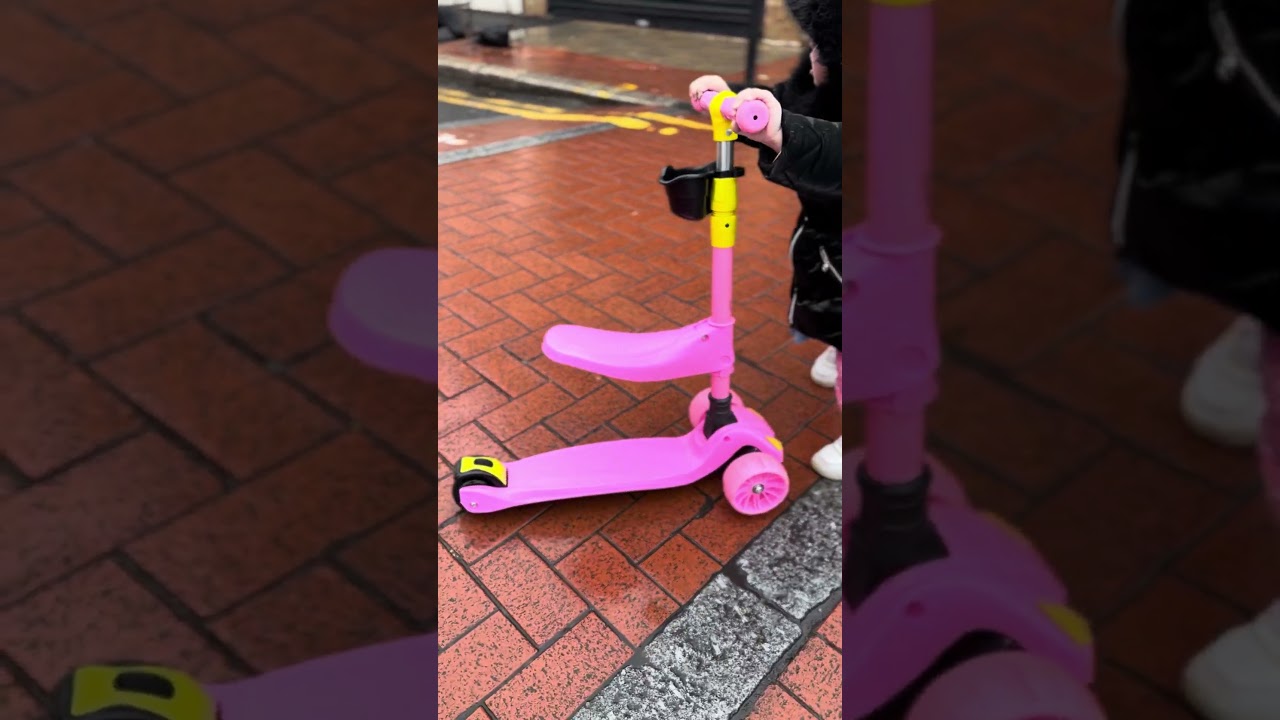 Little baby scootering on Saturday rainy morning in London