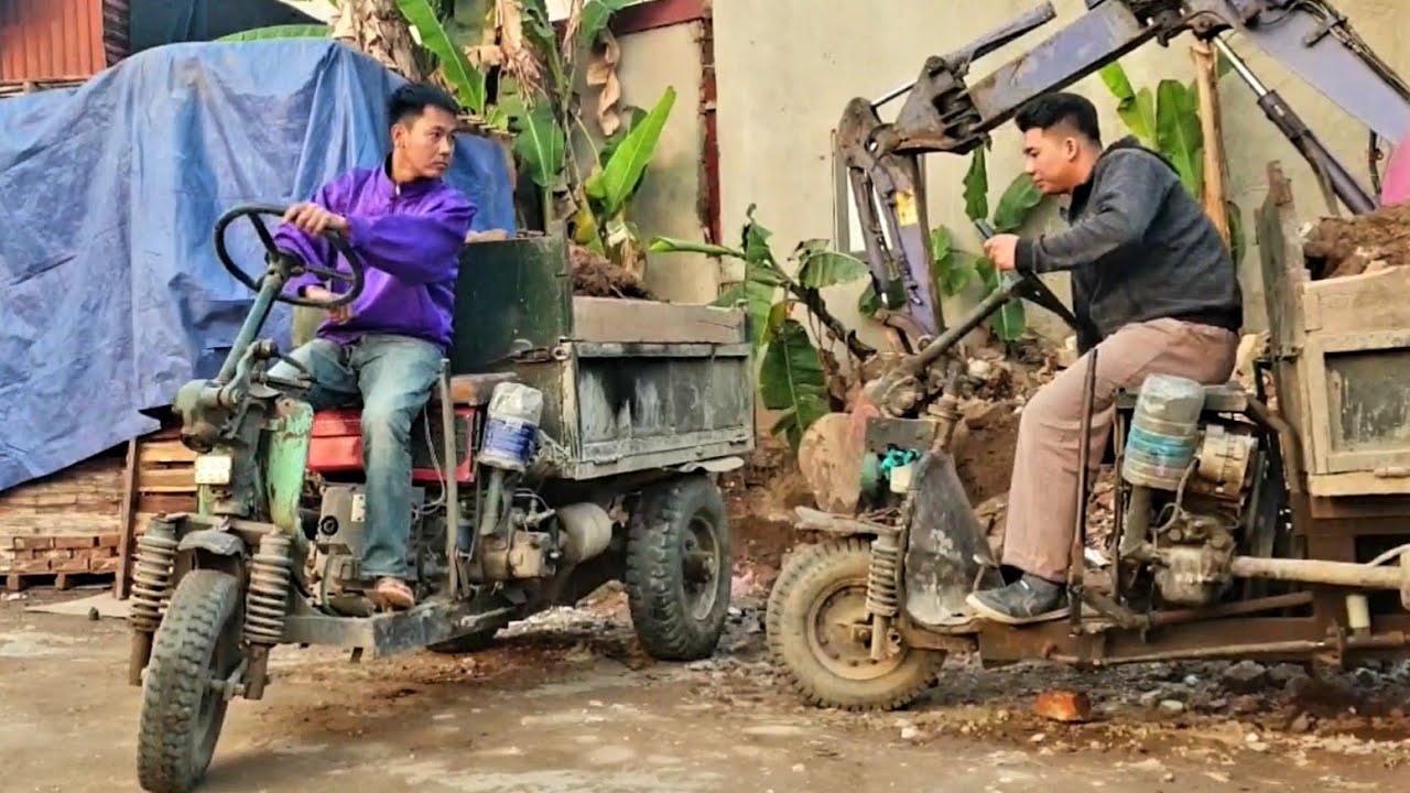 A pair of farm vehicles carrying excavated soil