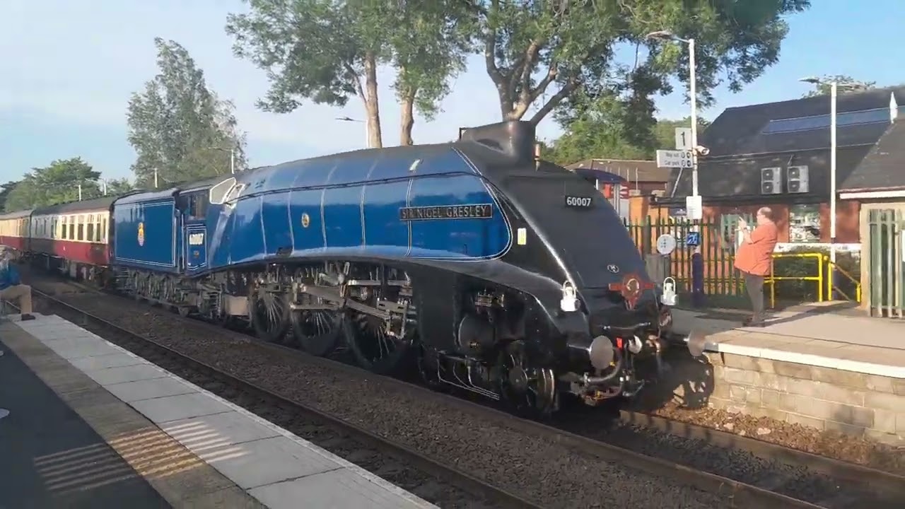60007 sir nigel gresley coming into Clitheroe running 2 minutes late from carlisle to crewewith a 47