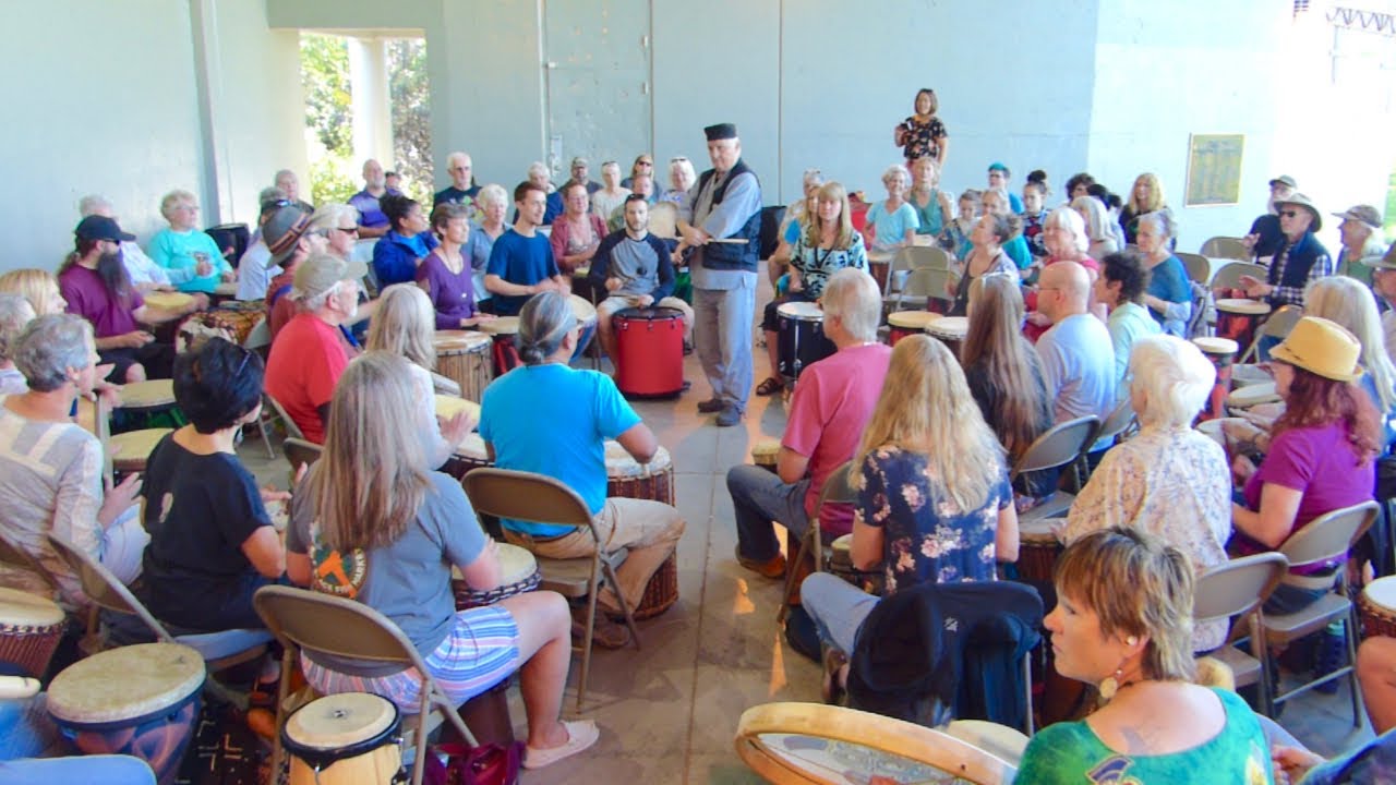 Arthur Hull facilitates drum circle in Loveland, Colorado