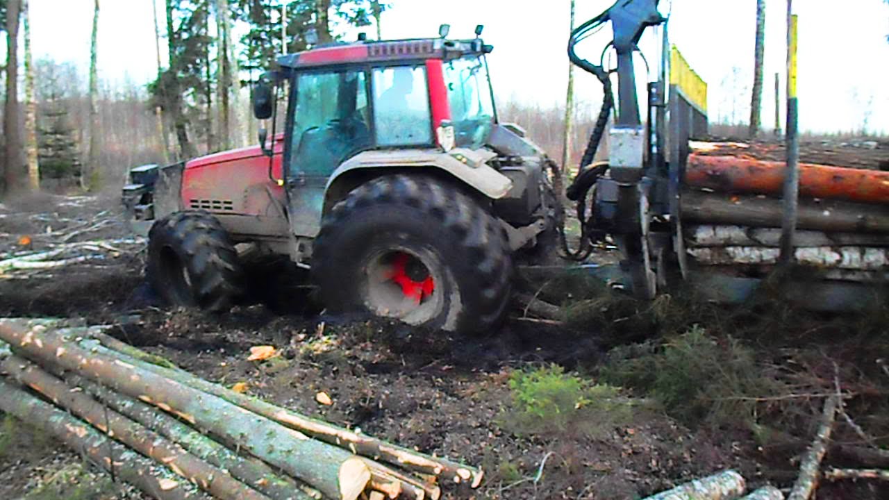 Valtra 6850 forestry tractor working in wet forest