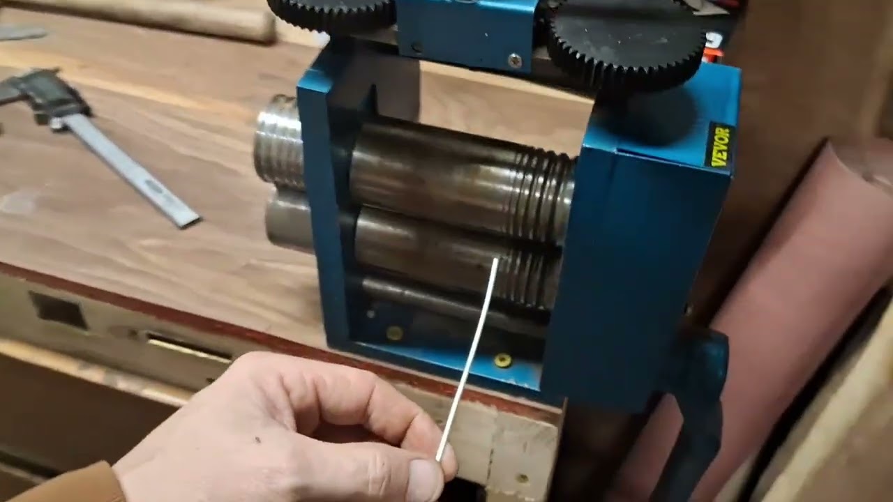 Rolling and drawing out silver wire.