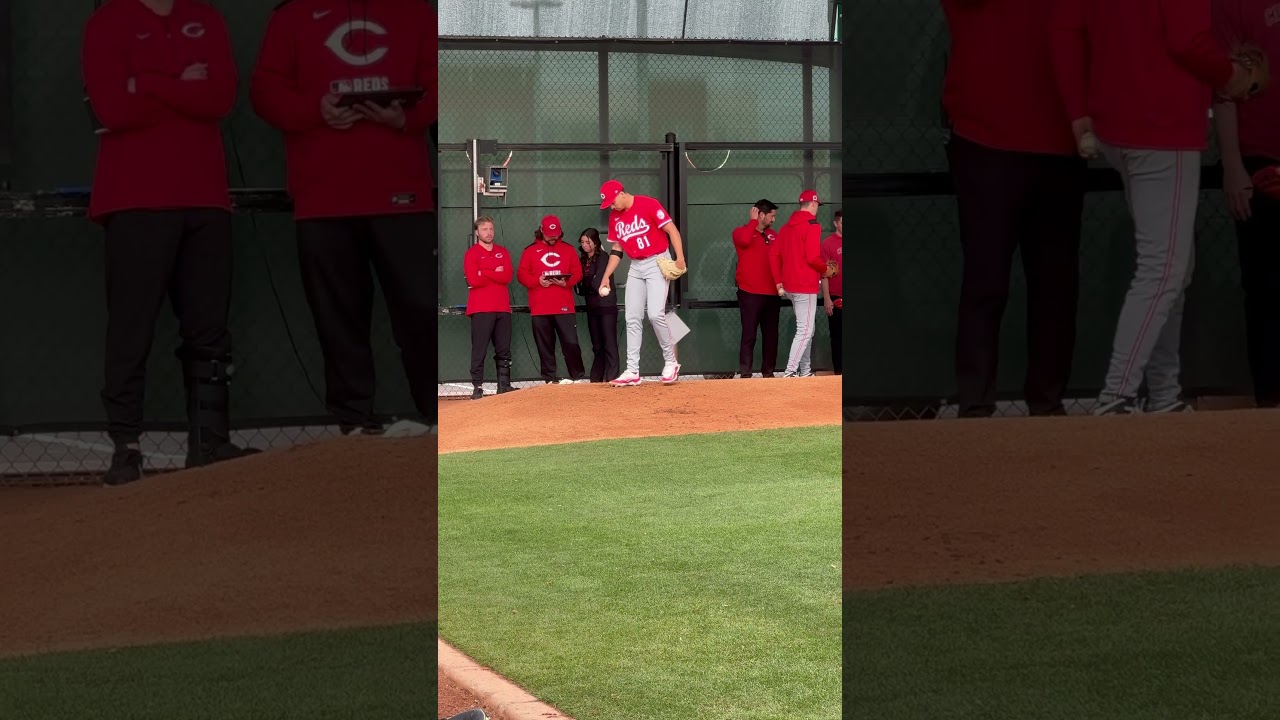 Chase Burns works in Reds side session Monday in Camp