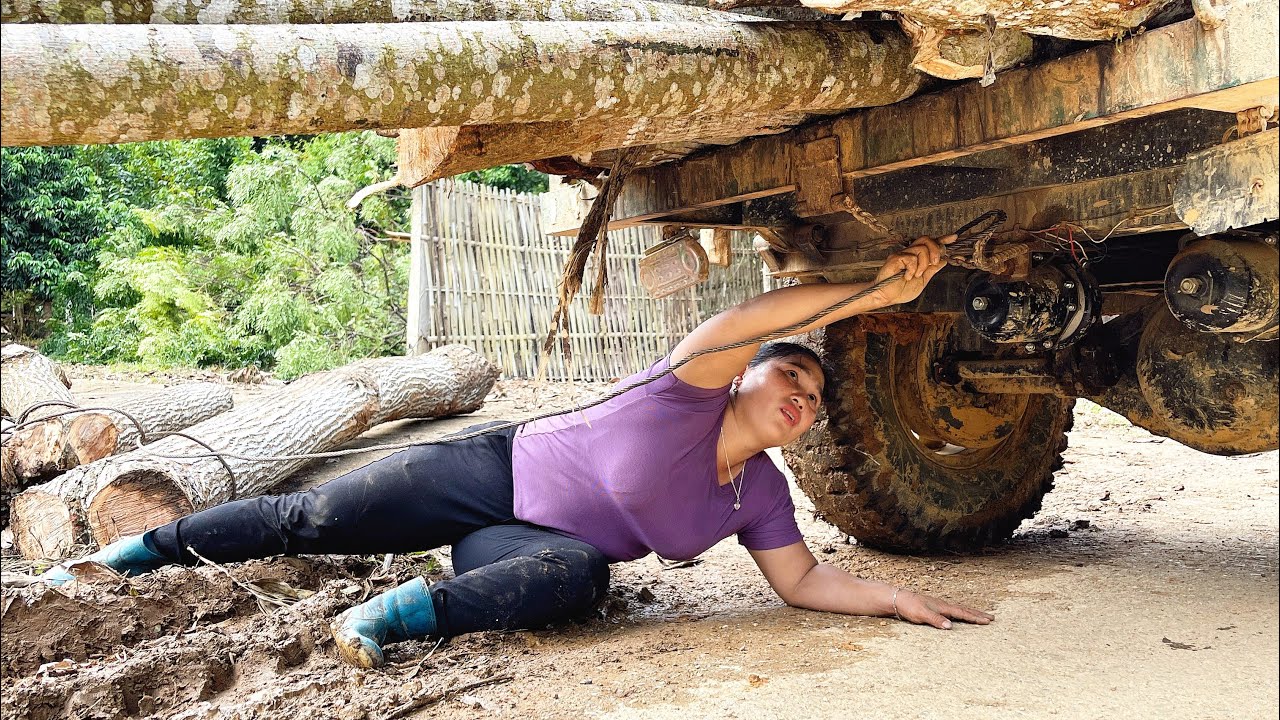 agricultural vehicle transporting wood, working skills and smart transportation of the girl
