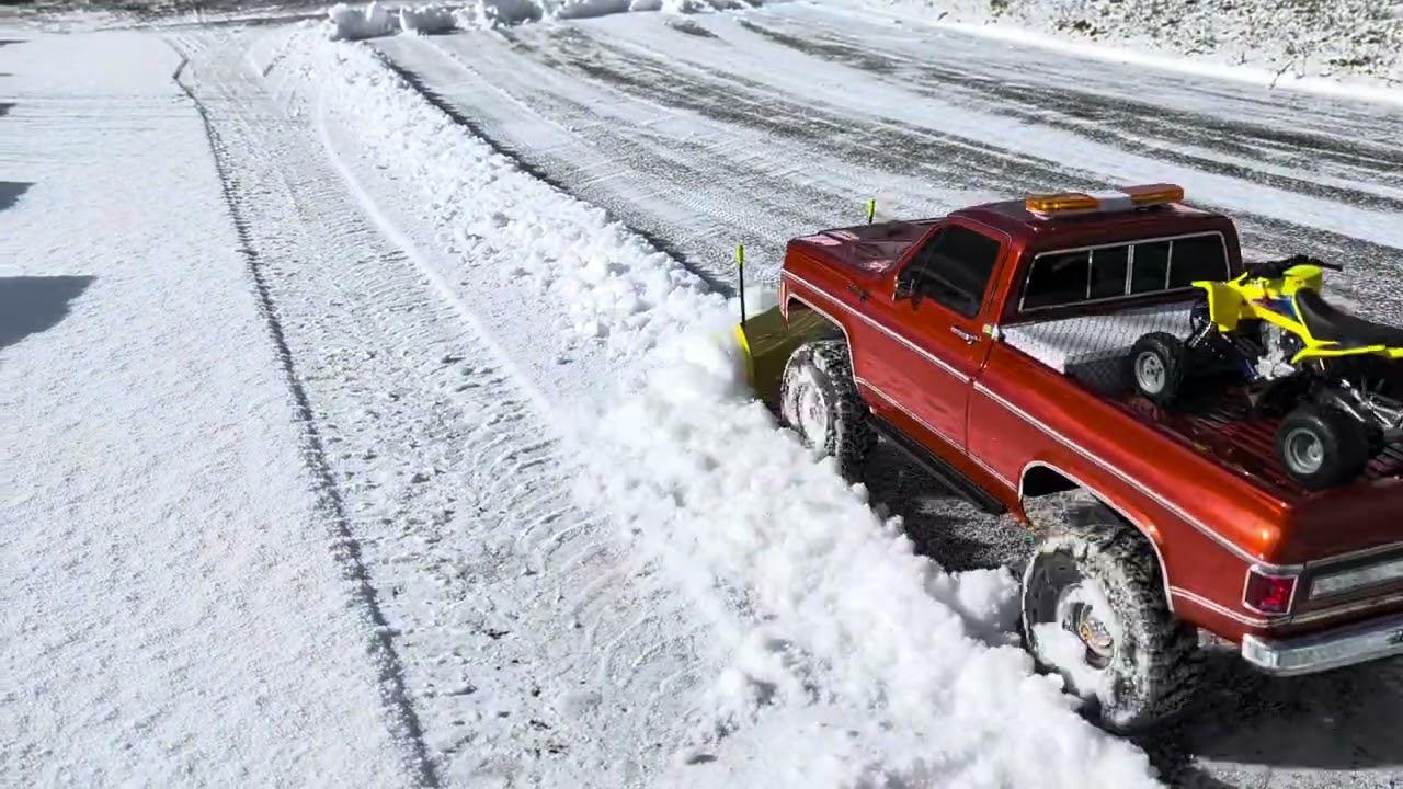 TRX4 High Trail plowing driveway