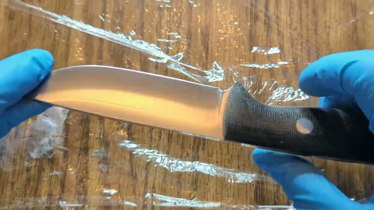 Polishing knives with Flitz.