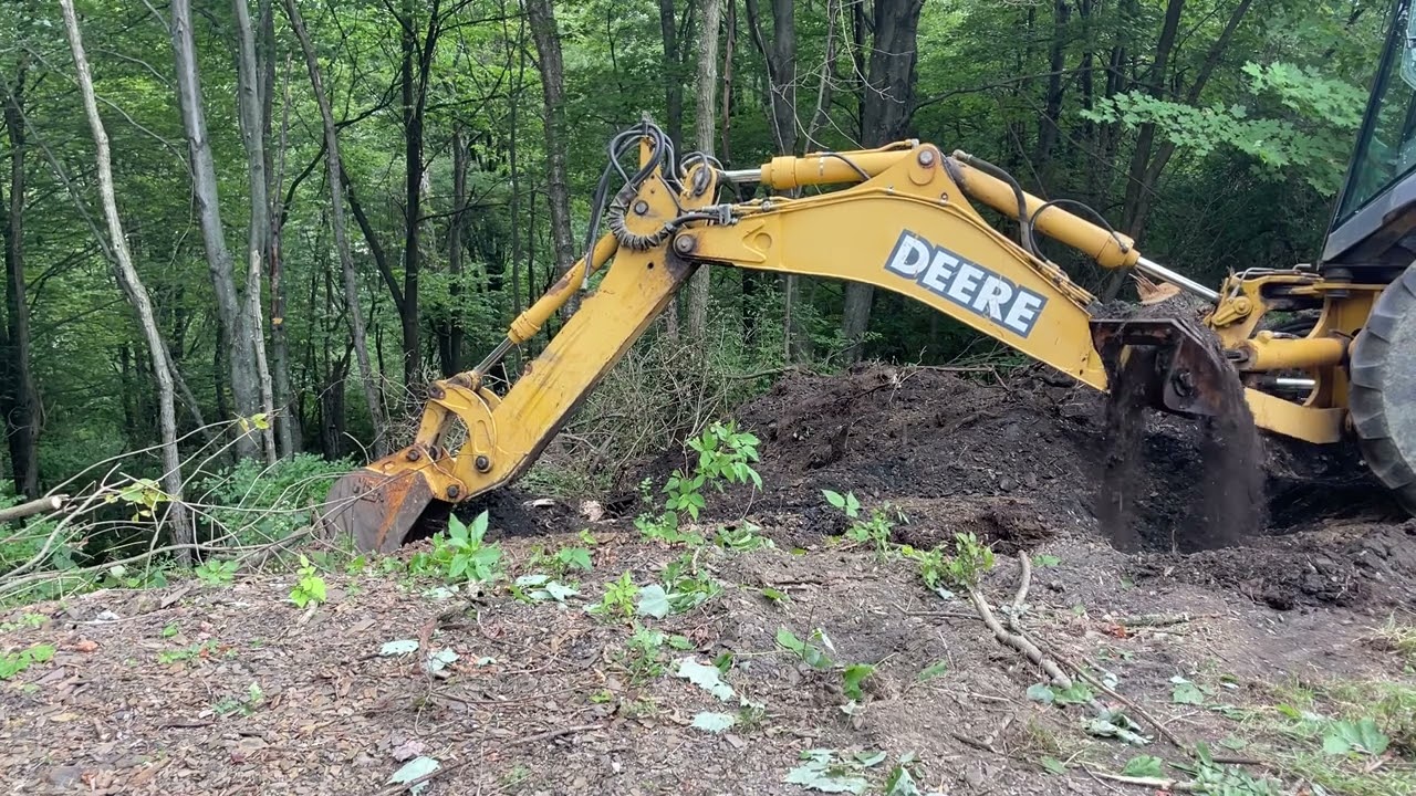 Digging out 2 stumps | Deere 310SG