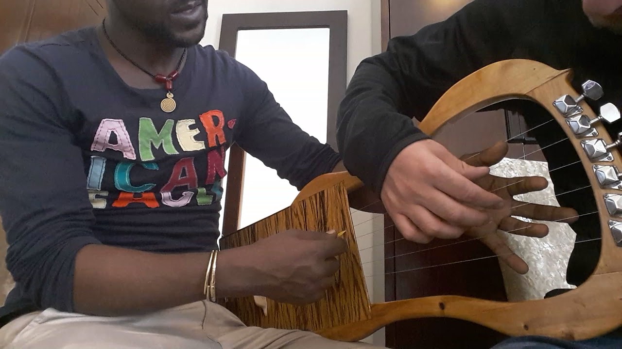Semo strums some chords. Kirar with Semo