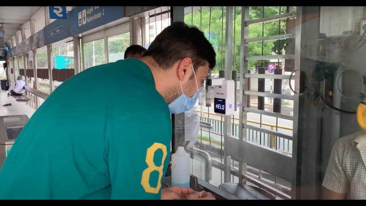 Fevobot Automatic Wall-mounted Thermometer installed at public transit | Fevo