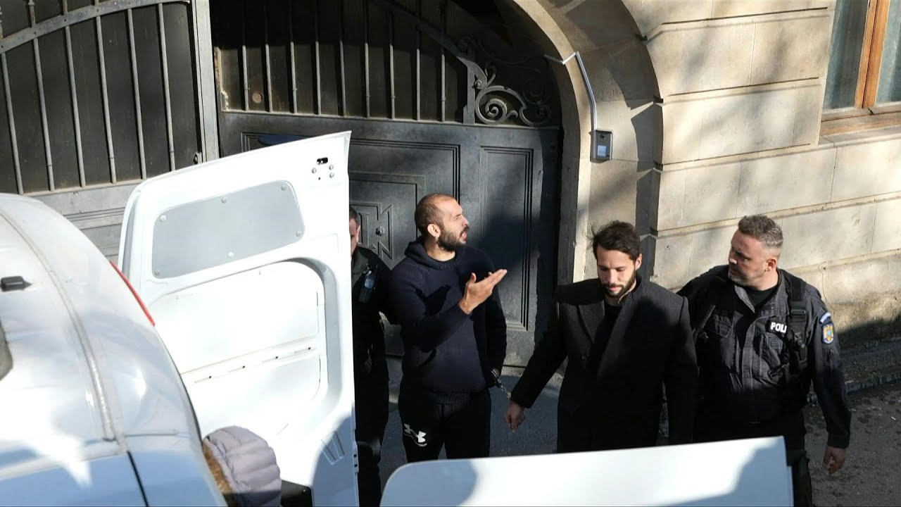 'You'll soon find out the truth': Tate brothers leave court in Romania after hearing | AFP