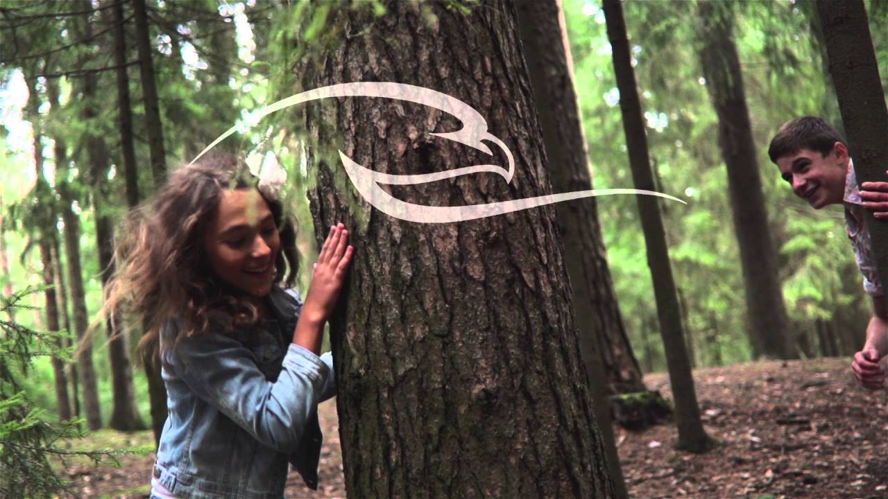 Young Boy And Girl Enjoying In The Forest